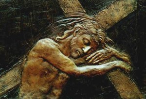 Jesus embraces cross